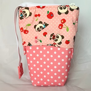 So clever! Panda pink polka dot print sliding standing pen pouch.  Keep your writing tools close at hand, even on the go!