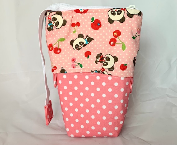 So clever! Panda pink polka dot print sliding standing pen pouch.  Keep your writing tools close at hand, even on the go!