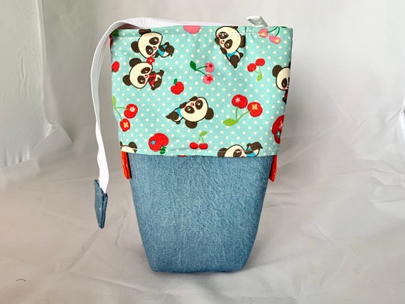 So clever! Panda blue with pink polka dot print sliding standing pen pouch.  Keep your writing tools close at hand, even on the go!