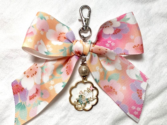 Blooming bow charm in cherry blossom ribbon and Japanese style enamel cat pendant. Unique eye candy to embellish your planner or bag!