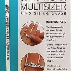 May include: White plastic ring sizer tool with a measuring tape on one side and instructions on the other. The instructions explain how to use the tool to measure ring size. The tool is labeled "World Famous Multisizer Ring Sizing Gauge".