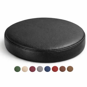 May include: A round, black, leather-like stool cushion. The cushion is circular with a stitched edge. Below the cushion are color swatches in green, beige, burgundy, gray, blue, red, brown, and tan.