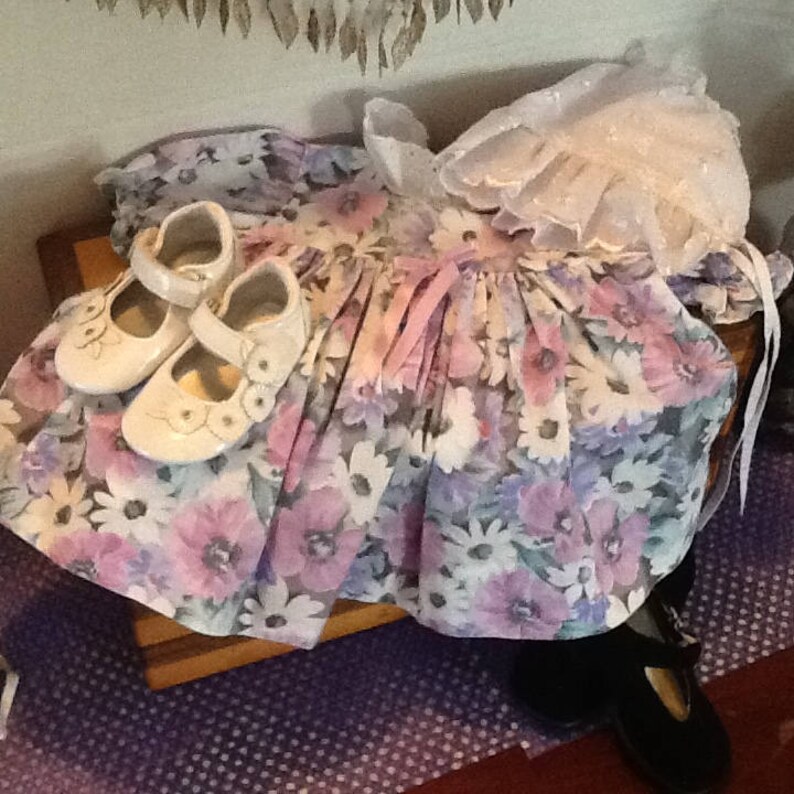purple and green flowers for Easter or that cool spring or summer day. white filled with pink A beautiful bold coloured flowered dress