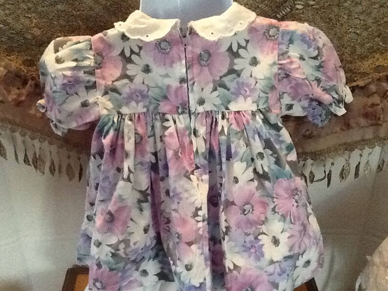 purple and green flowers for Easter or that cool spring or summer day. white filled with pink A beautiful bold coloured flowered dress