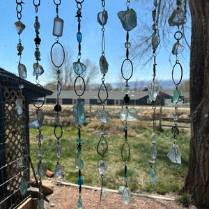 Beach glass strung with sea creatures and glass beads.