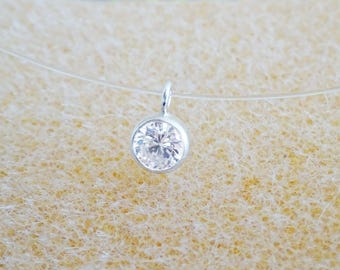 Illusion necklace with a small 4mm (0.16 inch) zircon stone, 925 sterling silver, invisible choker, transparent nylon thread, and solitaire pendant.