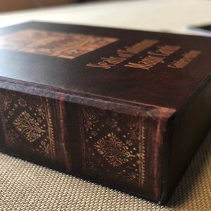 May include: A brown leather-bound box with gold accents and the text "Seals of Governance Major Cities" on the top.