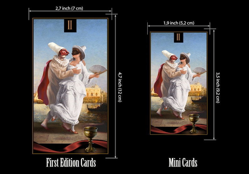 May include: Two figures in masquerade costumes, a man and a woman, dance in front of a Venetian cityscape. The man wears a red and white costume with a mask, and the woman wears a white dress with a mask. A golden chalice sits on a red ribbon in the foreground. The card is labeled "II" in the top left corner. The card measures 2.7 inches by 4.7 inches.