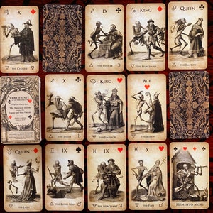 May include: A collection of tarot cards featuring illustrations of skeletons and figures in historical attire. The cards have a vintage aesthetic with detailed drawings and text. The deck includes a certificate of authenticity.