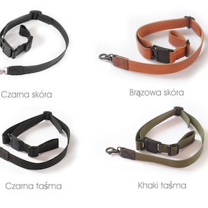 May include: Four camera straps in different colours and materials: black leather, brown leather, black webbing, and khaki webbing. Each strap has a metal clip and a black adjustable buckle.