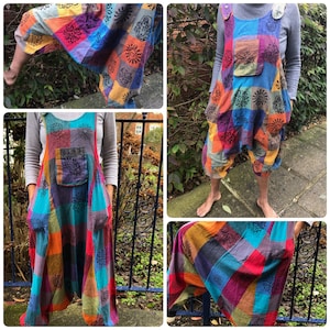 May include: Multicoloured patchwork jumpsuit with a large pocket on the front. The jumpsuit has a loose, flowing fit and is made of a soft, comfortable fabric.