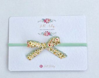 Floral bow with lace edging headband