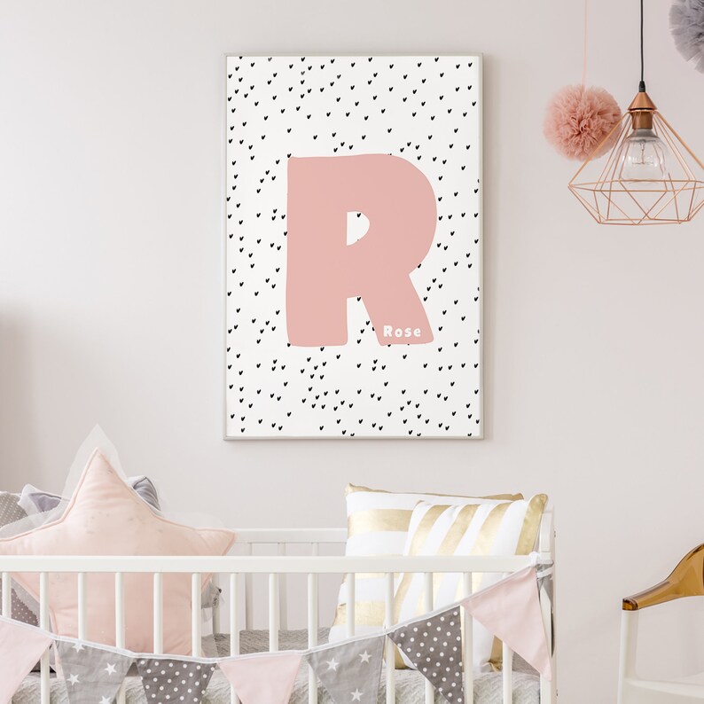May include: Pink letter R with black hearts on a white background. The name "Rose" is written below the letter.