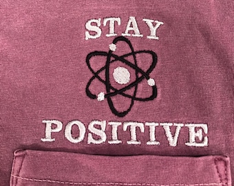 Stay positive Embroidered pocket t-shirt, Be a proton Atom Shirt, Science nerd gift, SHORT Sleeve Comfort Colors,