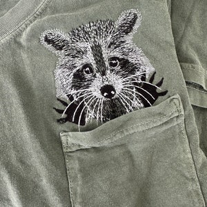 Raccoon pocket shirt, peekapoo tee,  face Unisex SHORT Sleeve Comfort Colors, Embroidered Pocket T-Shirt
