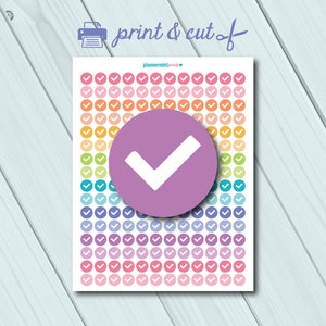 May include: A sheet of printable planner stickers with a rainbow of colours. The stickers are round and feature a white tick in the centre. The sheet includes a large purple circle with a white tick in the centre.