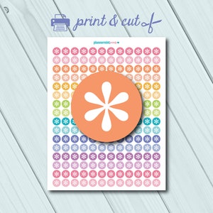 May include: A sheet of printable planner stickers with a rainbow gradient of colors. The stickers feature a white starburst design. The sheet includes the text "print & cut of" and "plannermint.co".
