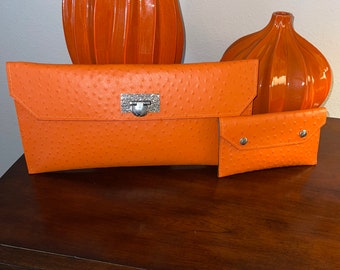 FINALE/Orange leather Clutch bag with matching wallet