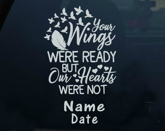 May include: White vinyl decal with the text "Your Wings Were Ready But Our Hearts Were Not" and space for a name and date. The decal features a flock of birds and hearts.