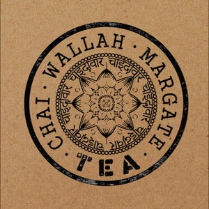May include: Black and white circular stamp with the text "Chai Walla Margate Tea" around the edge. The center of the stamp features a black and white mandala design with the text "चाइदावार" repeated around the edge.