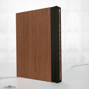 Back cover of the Coraline special edition book, made of solid wood with a smooth natural grain and minimalist finish