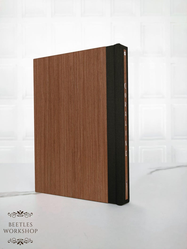 Back cover of the Coraline special edition book, made of solid wood with a smooth natural grain and minimalist finish