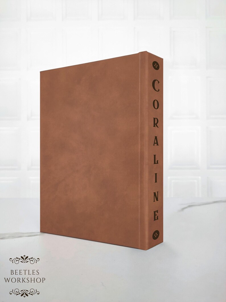 spine detail Coraline handcrafted hardcover with decorative elements,
back cover of minimalist Coraline rebound edition neutral aesthetic