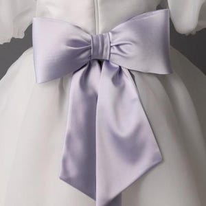 personalized first communion dress, custom flower girl dress, embroidered belt dress, first holy communion outfit, heirloom dress for girls, embroidered sash dress, ivory dress with monogram, white dress with big bow, special occasion dress girl, birthday dress with embroidered sash, wedding dress for young girls, flower girl dress with ribbon bow, baptism dress with embroidered belt
