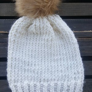 Cream knit beanie with faux pom