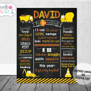 May include: A black chalkboard style birthday poster with yellow and orange construction vehicle graphics. The poster says "David my 3rd birthday" and lists favorite toys, foods, books, and activities. It also says "I am talkative, snuggly, happy, energetic. This year I got a big boy bed!"