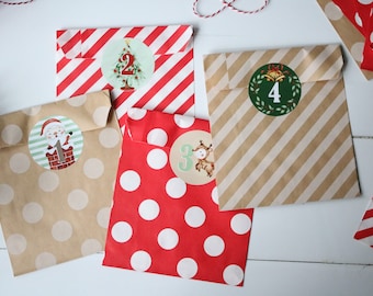 May include: Four brown paper bags with different patterns, including red and white stripes, red and white polka dots, and brown with white polka dots. Each bag has a round sticker with a Christmas-themed image and a number from 1 to 4.