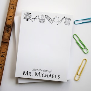 May include: White notepad with a black border and a line of school-themed icons at the top. The text "from the desk of MR. MICHAELS" is at the bottom.