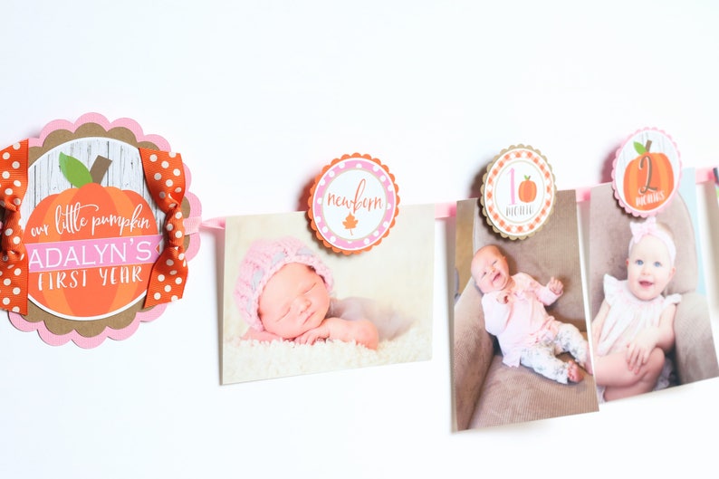 May include: A pink and orange pumpkin-themed baby photo banner with the text "our little pumpkin ADALYN'S FIRST YEAR" and photos of a baby at different ages.