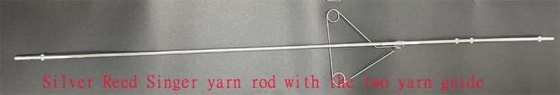 May include: Silver Reed Singer yarn rod with two yarn guides.