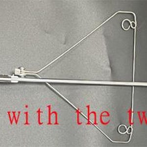May include: A silver yarn rod with two yarn guides. The text "Brother yarn rod with the two yarn guide" is visible in the image.