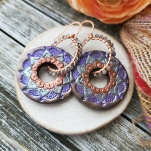 Colorful mandala hoop earrings made from polymer clay with iolite gemstones