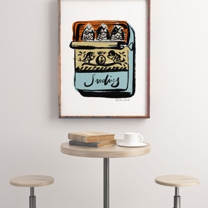 May include: A vintage-style illustration of a can of sardines with the word "Sardines" written in cursive on the front. The can is blue with a yellow and orange lid and features a black and white illustration of fish on the front.