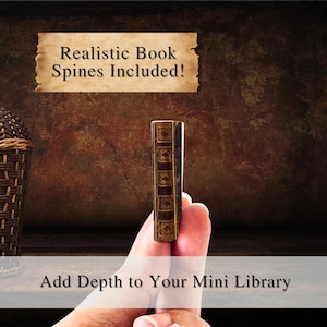 May include: A miniature book spine with gold accents is held between fingers. The spine is brown and gold with decorative details. Text above reads "Realistic Book Spines Included!" and text below reads "Add Depth to Your Mini Library".