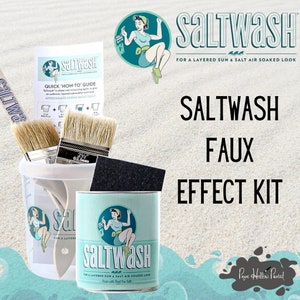 May include: A Saltwash Faux Effect Kit with a vintage-style design. The kit includes brushes, a mixing container, a sanding sponge, and a can of Saltwash. The packaging features a retro illustration of a woman and the text "Saltwash".