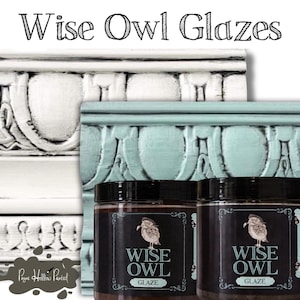 May include: Two jars of Wise Owl Glaze with a black label featuring an owl illustration. The jars are in front of painted wood trim in white and teal. The text "Wise Owl Glazes" is at the top of the image.