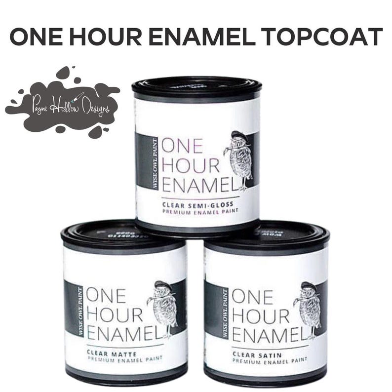 May include: Three cans of Wise Owl Paint enamel topcoat are stacked. The cans are white with black lids and feature the text "ONE HOUR ENAMEL" and an owl illustration. The text "CLEAR SEMI-GLOSS", "CLEAR MATTE", and "CLEAR SATIN" are visible.