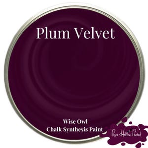 May include: A tin of Plum Velvet chalk synthesis paint by Wise Owl. The paint is a deep, rich purple colour with a metallic silver rim. The words "Plum Velvet" are printed in white across the top of the tin.