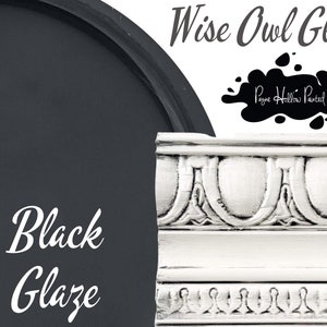 May include: A sample of Wise Owl Glaze in the color Black Glaze. The glaze is a dark, rich black color. The text "Wise Owl Glaze" and "Payne Hollow Painted" is visible in the image.