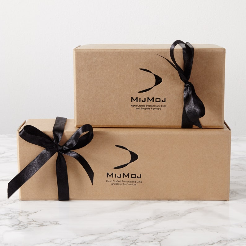 May include: A set of three ceramic mugs with a speckled, matte finish in cream, light grey, and dark grey. Each mug has a simple, minimalist design and a rounded handle.