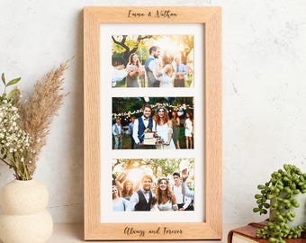 May include: A light-colored wooden triple photo frame with three rectangular openings, each displaying a wedding photo. The top of the frame reads "Emma & Nathan," and the bottom reads "Always and Forever."