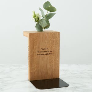 Solid oak bookend with engraved message and decorative stem vase making the perfect gift for the bookworm or academic in your life. Hidden engraving on the back for a more discreet secret message.