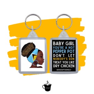 May include: A keychain with a black and white image of a woman with a crown and a blue and yellow flag on her head. The text on the keychain reads "Baby Girl You're a Hot Pepper Pot Don't Let Nobody's Son Treat You Like Dry Chicken @EDUCUPYOURSELF".