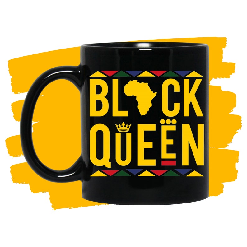 May include: Black ceramic coffee mug with a black and yellow graphic design. The design features the text "Black Queen" with a crown and an outline of the continent of Africa.