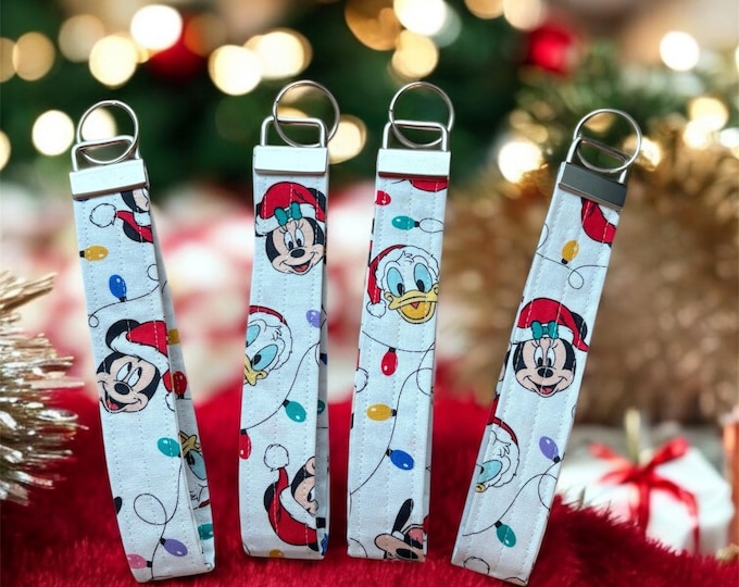 Very Merry Christmas Disney themed key wristlets that add a touch of magic to your celebrations and travels.