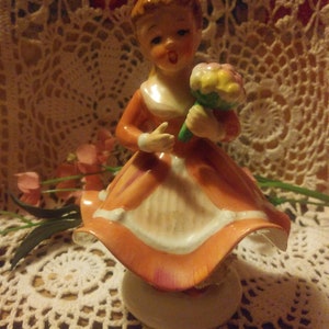 Napco Girl in pink flowing dress w/ flower bouquet